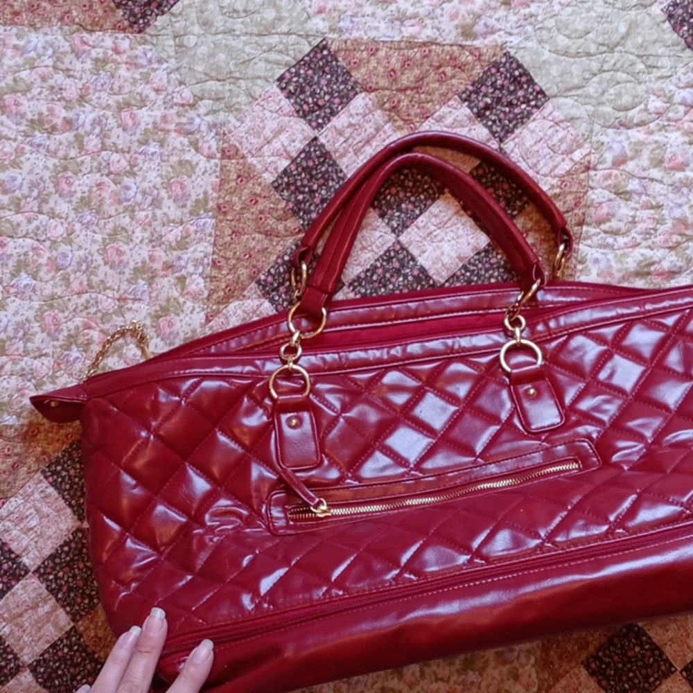 Very Red & gold over night bag with bottom cubby